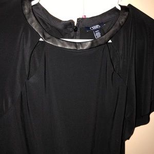 Black dress. Knee length. Leather neck line.